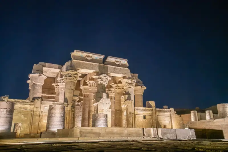 Kom Ombo Temple illuminated against twilight sky in Egypt, ancient astronomical site along the Nile River for celestial event viewing